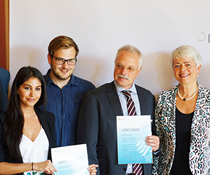 group holding up awards