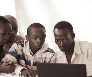 group of boys at computer